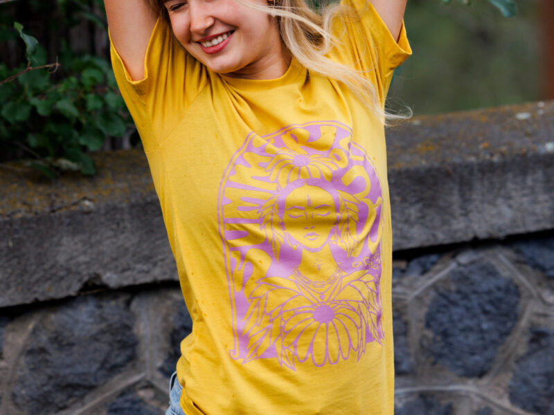 Summer of OM 2026 Women's Relaxed Fit Yoga Shirt Golden Violet | Asana x Lisa Chancellor | Hand drawn art.